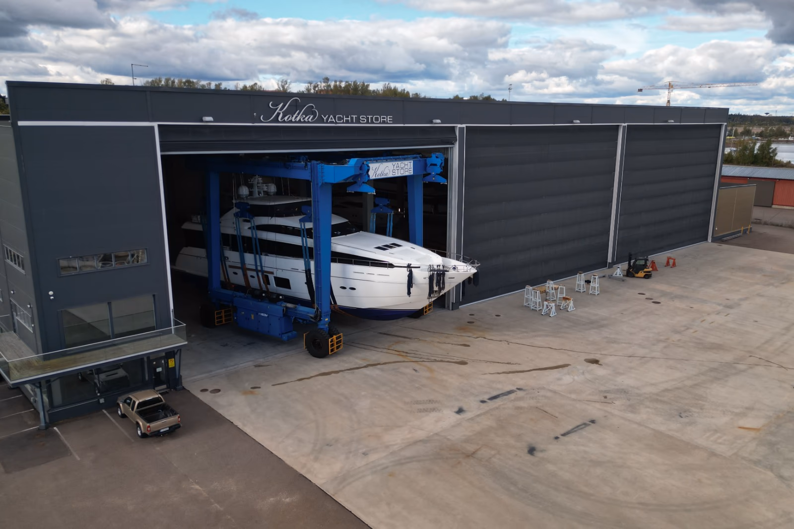 Large motor yacht entering Kotka Yacht Store's service facility